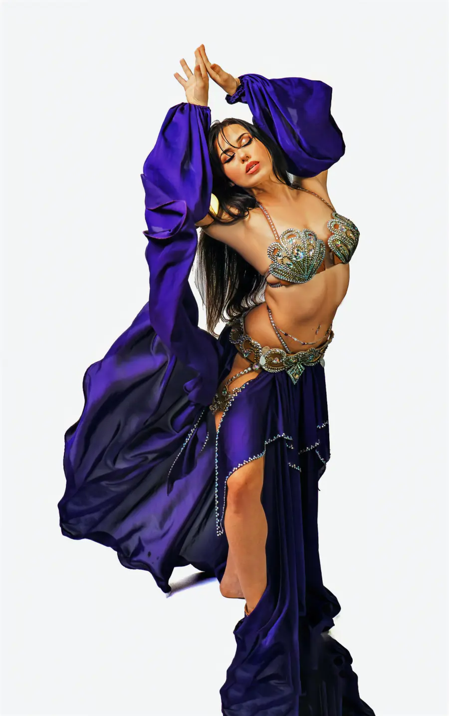 Belly dancer Azeeria Azizah with hands joined overhead, purple sleeves cascading